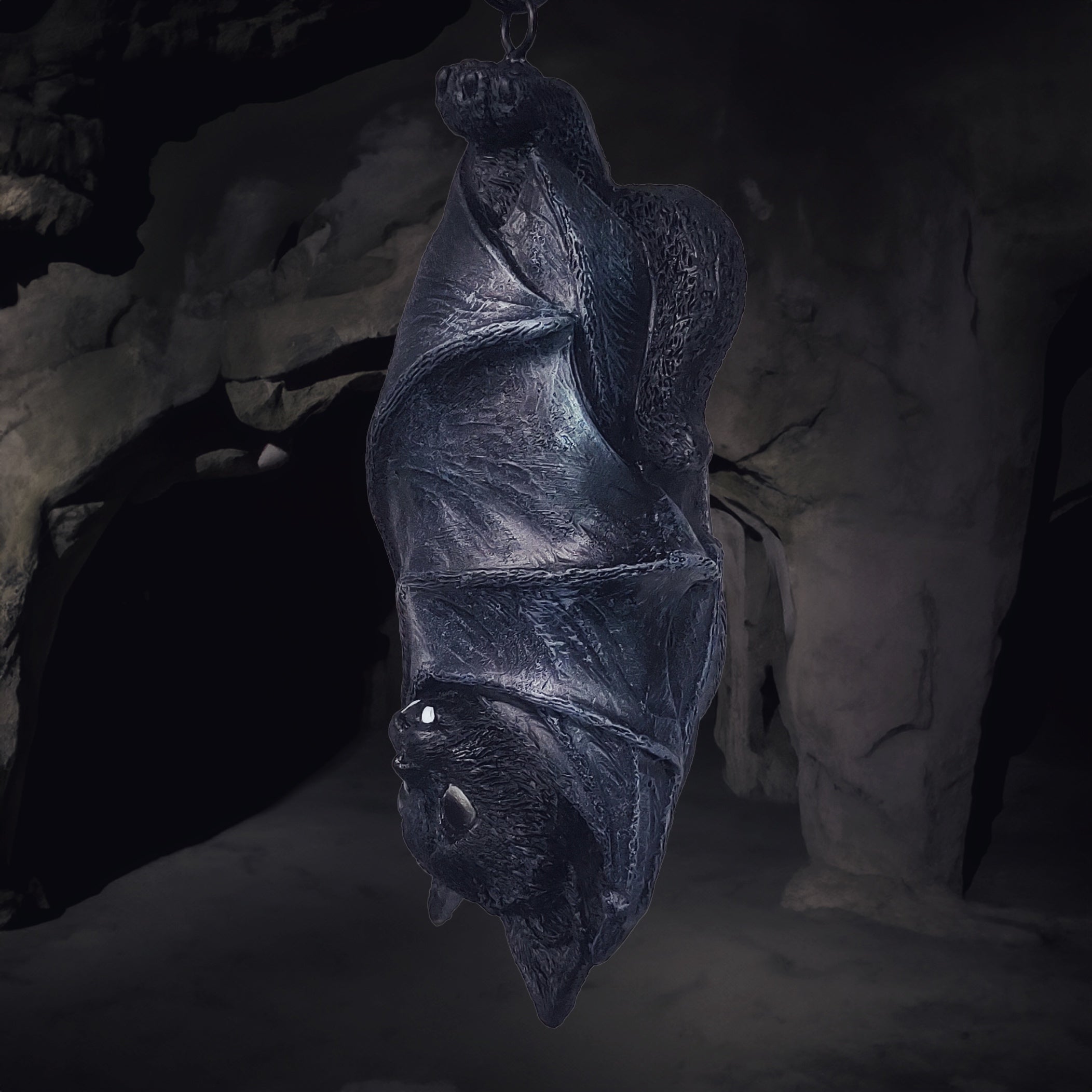 Hanging cat in bat wings